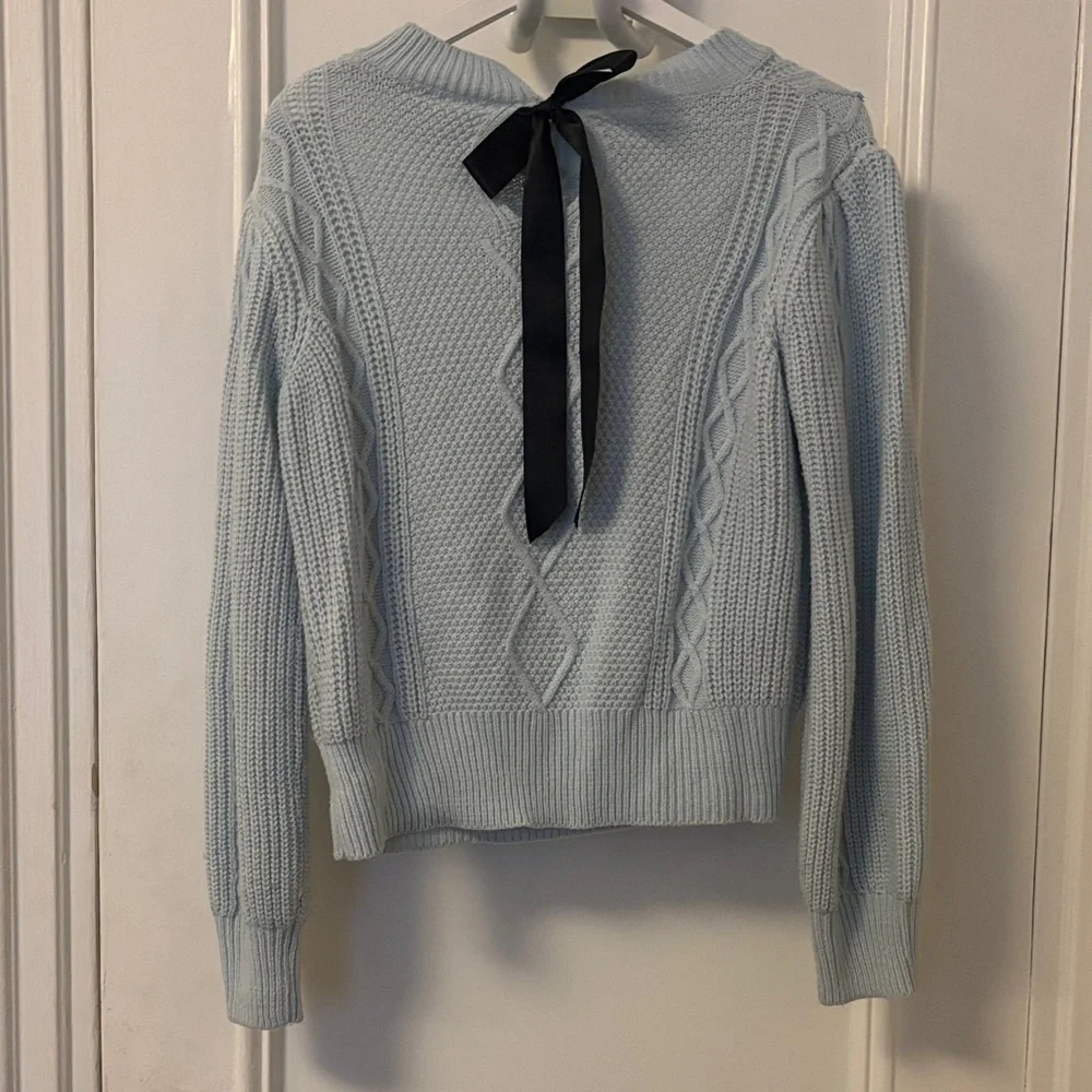 Elegant Light Blue Knit Sweater with Embellishments